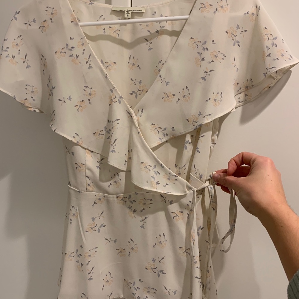 Light pink floral wrap-style blouse. Side S.